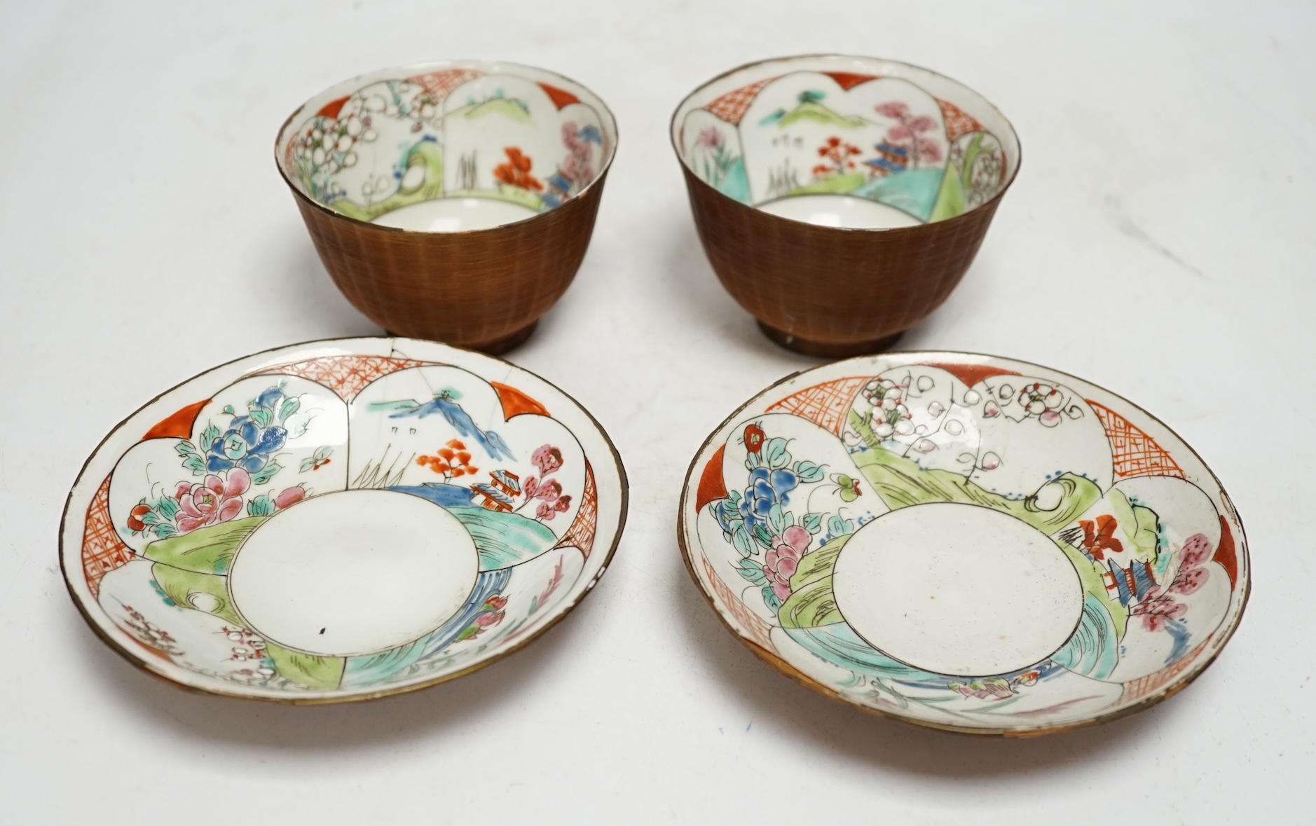 Two pairs of Japanese bamboo bound tea bowls and saucers. Condition - fair